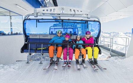 Family riding the ski lift.